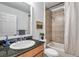 Bright bathroom features a sleek vanity with a granite countertop and a shower-tub combination at 2407 Kensington Greens Dr, Sun City Center, FL 33573