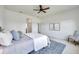 Spacious primary bedroom with a cozy rug and lots of natural light at 2407 Kensington Greens Dr, Sun City Center, FL 33573