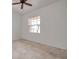 Clean bedroom with neutral tiled floors, and a ceiling fan at 2407 Kensington Greens Dr, Sun City Center, FL 33573