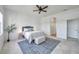Bright bedroom with tile floors, neutral decor, and a stylish area rug at 2407 Kensington Greens Dr, Sun City Center, FL 33573