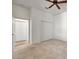 Neutral bedroom featuring tiled floors, a ceiling fan, and a double door closet at 2407 Kensington Greens Dr, Sun City Center, FL 33573