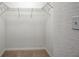 Walk-in closet featuring wire shelving and neutral carpeting at 2407 Kensington Greens Dr, Sun City Center, FL 33573