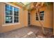 Exterior entrance, showcasing tiled porch with palm tree, and exterior architecture at 2407 Kensington Greens Dr, Sun City Center, FL 33573