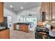 Well-lit kitchen boasts modern appliances and an open layout connecting to the living space at 2407 Kensington Greens Dr, Sun City Center, FL 33573
