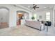 Bright and spacious living room with an open view of the kitchen at 2407 Kensington Greens Dr, Sun City Center, FL 33573