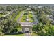 Aerial view looking through an entry gate to a central globe fountain at 2416 World Parkway Blvd # 26, Clearwater, FL 33763