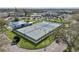 A community boasts tennis courts, a pool, and a clubhouse among lush landscaping at 2416 World Parkway Blvd # 26, Clearwater, FL 33763