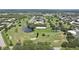 Aerial view of the community featuring a golf course, ponds, and lush landscaping at 2416 World Parkway Blvd # 26, Clearwater, FL 33763