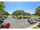 Aerial view of the parking lot with ample parking and lots of surrounding green spaces at 2416 World Parkway Blvd # 26, Clearwater, FL 33763