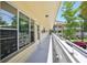 Balcony view with unit 26 and ample lighting, with a view of the landscaped yard at 2416 World Parkway Blvd # 26, Clearwater, FL 33763