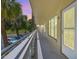 Well-maintained balcony featuring unit 26 with a view of the green space and nearby parking at 2416 World Parkway Blvd # 26, Clearwater, FL 33763