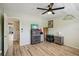 This is a neutral bedroom with a ceiling fan, and wood-look floors at 2416 World Parkway Blvd # 26, Clearwater, FL 33763