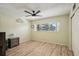 Neutral bedroom with a large window offering lots of natural light and wood-look laminate flooring at 2416 World Parkway Blvd # 26, Clearwater, FL 33763
