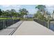 A quaint wooden bridge with black metal railings overlooks the calm water at 2416 World Parkway Blvd # 26, Clearwater, FL 33763