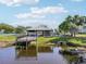 Exterior view of a community gazebo on the lake, with fishing and picnic areas at 2416 World Parkway Blvd # 26, Clearwater, FL 33763