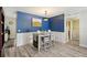 Charming dining room with stylish lighting, attractive wall accents, and seating for four at 2416 World Parkway Blvd # 26, Clearwater, FL 33763