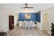 Open dining room features elegant decor, ceiling fan, and hardwood floors at 2416 World Parkway Blvd # 26, Clearwater, FL 33763
