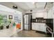 Modern kitchen featuring stainless steel appliances and black backsplash at 2416 World Parkway Blvd # 26, Clearwater, FL 33763