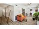 Comfortable living area with hardwood floors, ceiling fan, and stylish decor at 2416 World Parkway Blvd # 26, Clearwater, FL 33763