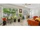 Comfortable living room with hardwood floors, ceiling fan, and lots of natural light at 2416 World Parkway Blvd # 26, Clearwater, FL 33763