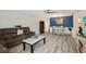 Open floor plan with a spacious living room with sofa and direct access to the dining area at 2416 World Parkway Blvd # 26, Clearwater, FL 33763