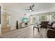 Cozy living room with wood flooring, ceiling fan, and lots of natural light at 2416 World Parkway Blvd # 26, Clearwater, FL 33763