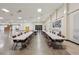 Large open meeting room with many tables and chairs plus neutral colors, offering versatile gathering space at 2416 World Parkway Blvd # 26, Clearwater, FL 33763