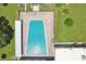 An aerial view of the large community pool with lounge seating and plenty of space to swim at 2416 World Parkway Blvd # 26, Clearwater, FL 33763