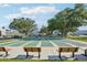 Outdoor shuffleboard courts in a scenic setting with benches and landscaping, promoting community activity at 2416 World Parkway Blvd # 26, Clearwater, FL 33763