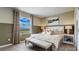 Relaxing bedroom with a large window, plush bedding, and stylish furnishings at 259 Royal Spoonbill Dr, Ruskin, FL 33570