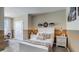 Stylishly decorated bedroom with a double bed, bedside tables, and unique wall art at 263 Royal Spoonbill Dr, Ruskin, FL 33570