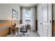 Comfortable home office space with a desk, chair, and natural light from a window at 263 Royal Spoonbill Dr, Ruskin, FL 33570