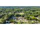 Panoramic aerial view showcases a property nestled among lush greenery with a long driveway and beautiful tree coverage at 26438 Glenwood Dr, Wesley Chapel, FL 33544
