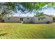 Large grassy backyard offers ample space for relaxation and recreation at 26438 Glenwood Dr, Wesley Chapel, FL 33544