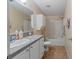 Modest bathroom features a vanity, toilet, and shower-tub combination at 26438 Glenwood Dr, Wesley Chapel, FL 33544