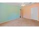 Colorful bedroom featuring mint green and peach walls and neutral carpet at 26438 Glenwood Dr, Wesley Chapel, FL 33544