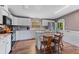 Modern kitchen featuring white cabinets, stainless steel appliances, and a convenient center island at 26438 Glenwood Dr, Wesley Chapel, FL 33544