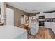 Spacious kitchen featuring white cabinets, modern appliances, and a functional center island at 26438 Glenwood Dr, Wesley Chapel, FL 33544