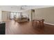 Bright living room offering hardwood floors, neutral paint and multiple windows for natural light at 26438 Glenwood Dr, Wesley Chapel, FL 33544