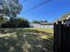 Spacious backyard with a grassy lawn, enclosed by a white privacy fence for added security at 2678 62Nd N Ave, St Petersburg, FL 33702