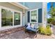 Backyard features a bench, lush landscaping, and a serene atmosphere at 2903 Pass A Grille Way, St Pete Beach, FL 33706