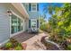 Serene backyard oasis with a bench, lush landscaping, and a peaceful ambiance at 2903 Pass A Grille Way, St Pete Beach, FL 33706