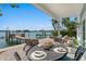 Scenic outdoor dining area with waterfront views and stylish decor at 2903 Pass A Grille Way, St Pete Beach, FL 33706