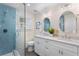Modern bathroom with a glass shower, dual sinks, and stylish fixtures at 2903 Pass A Grille Way, St Pete Beach, FL 33706