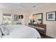Relaxing bedroom featuring a white bed, dresser, and stylish decor at 2903 Pass A Grille Way, St Pete Beach, FL 33706