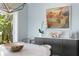 Bright dining area with modern decor, including abstract art and sculptural center piece at 2903 Pass A Grille Way, St Pete Beach, FL 33706