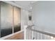 Hallway features wood floors, neutral paint, with modern art decorating the walls at 2903 Pass A Grille Way, St Pete Beach, FL 33706
