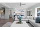 Open concept living room seamlessly connects to a bright white kitchen area at 2903 Pass A Grille Way, St Pete Beach, FL 33706