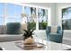 Close-up of a beautifully staged living room with stylish décor and natural light at 2903 Pass A Grille Way, St Pete Beach, FL 33706