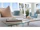 Cozy living room featuring a large window with a view, stylish decor, and comfortable seating arrangement at 2903 Pass A Grille Way, St Pete Beach, FL 33706